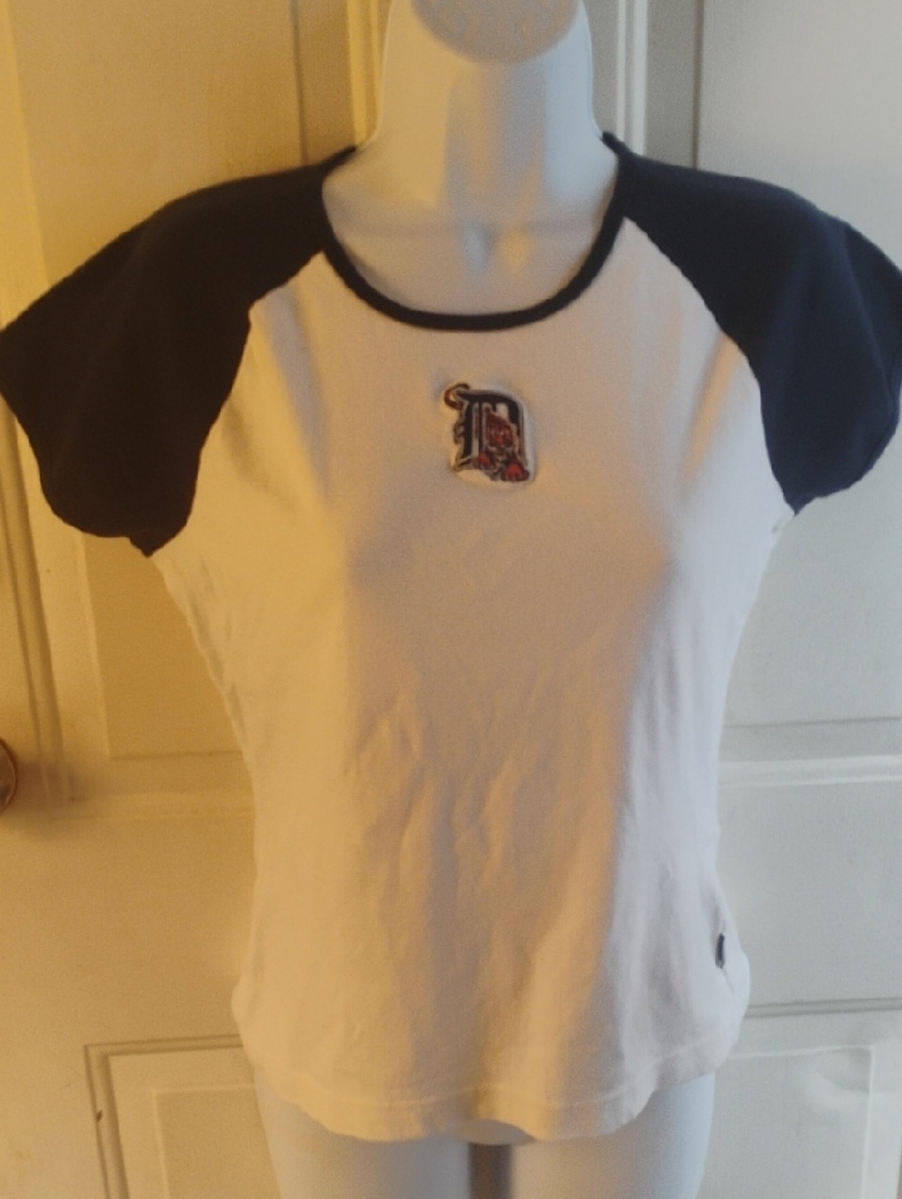 Antigua White and Black Raglan Kids Tee with Embroidered 'D' Patch. ( Read )